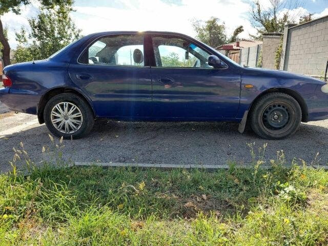 Синій Кіа Кларус, об'ємом двигуна 2 л та пробігом 256 тис. км за 951 $, фото 4 на Automoto.ua
