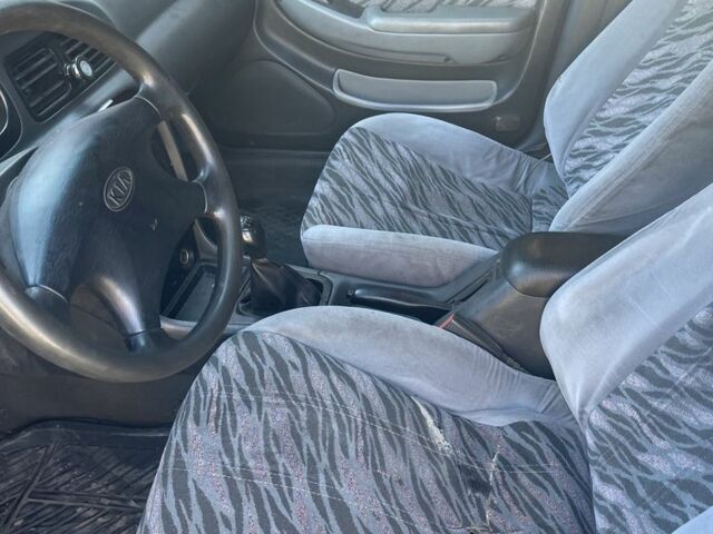 Синий Киа Кларус, объемом двигателя 2 л и пробегом 300 тыс. км за 950 $, фото 3 на Automoto.ua