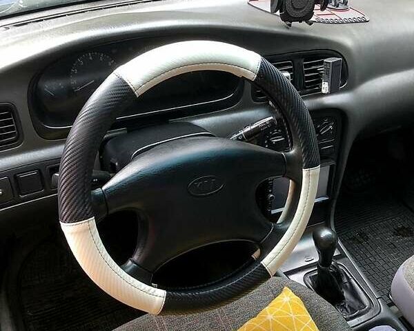 Синий Киа Кларус, объемом двигателя 2 л и пробегом 207 тыс. км за 1500 $, фото 4 на Automoto.ua