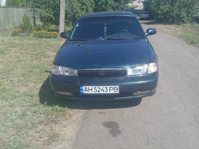 Зелений Кіа Кларус, об'ємом двигуна 2 л та пробігом 330 тис. км за 1773 $, фото 2 на Automoto.ua