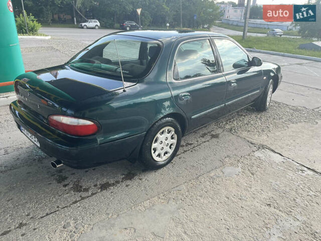 Зелений Кіа Кларус, об'ємом двигуна 1.79 л та пробігом 240 тис. км за 1450 $, фото 10 на Automoto.ua