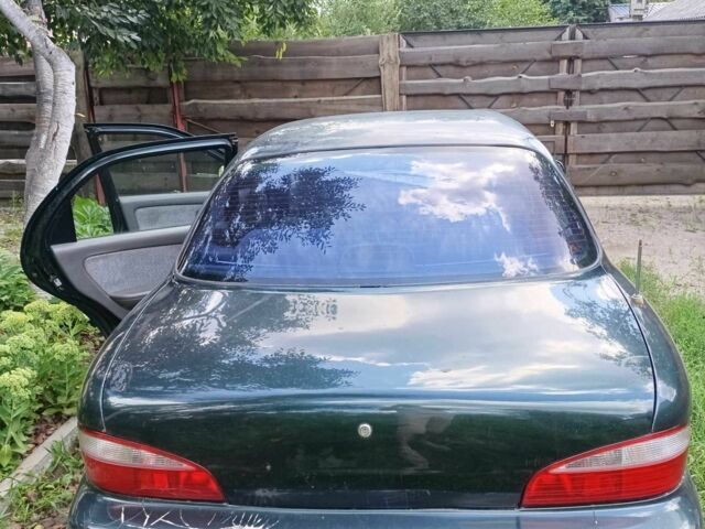 Зелений Кіа Кларус, об'ємом двигуна 2 л та пробігом 323 тис. км за 1000 $, фото 6 на Automoto.ua