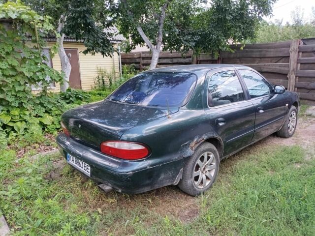 Зелений Кіа Кларус, об'ємом двигуна 2 л та пробігом 323 тис. км за 1000 $, фото 4 на Automoto.ua