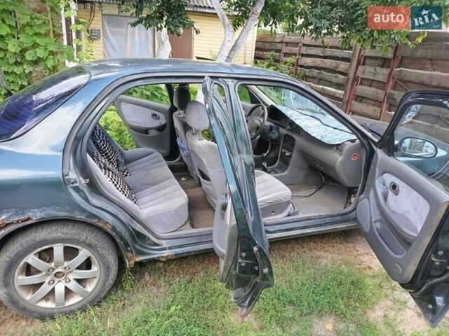 Зеленый Киа Кларус, объемом двигателя 2 л и пробегом 323 тыс. км за 1000 $, фото 7 на Automoto.ua