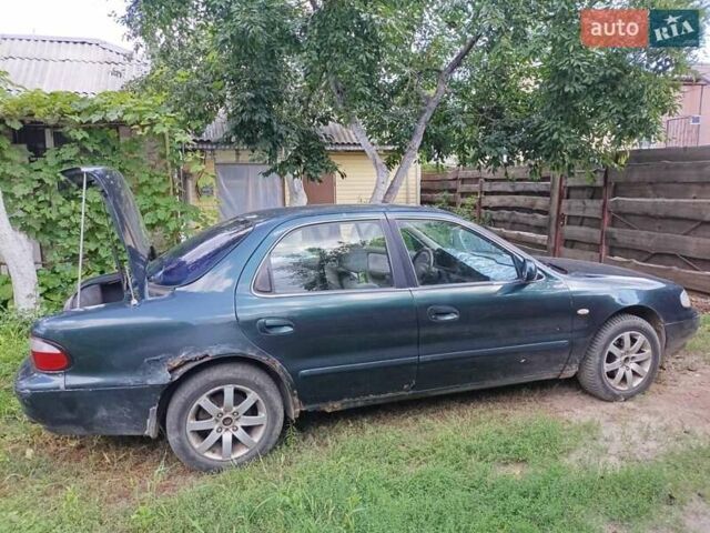 Зеленый Киа Кларус, объемом двигателя 2 л и пробегом 323 тыс. км за 1000 $, фото 2 на Automoto.ua