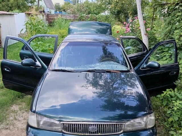 Зелений Кіа Кларус, об'ємом двигуна 2 л та пробігом 323 тис. км за 1000 $, фото 7 на Automoto.ua