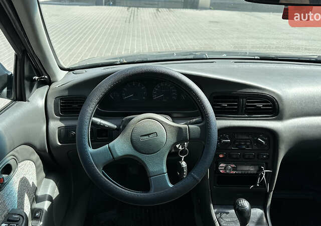 Зелений Кіа Кларус, об'ємом двигуна 2 л та пробігом 350 тис. км за 1999 $, фото 9 на Automoto.ua