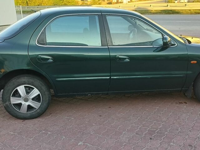 Зелений Кіа Кларус, об'ємом двигуна 1.8 л та пробігом 400 тис. км за 1800 $, фото 1 на Automoto.ua