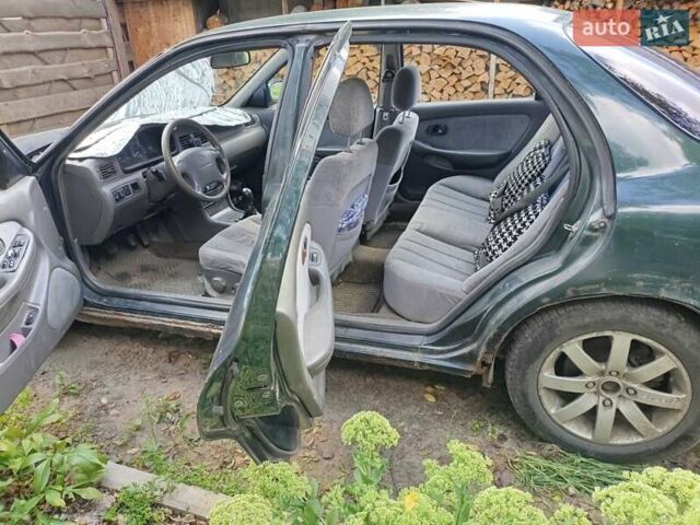 Зеленый Киа Кларус, объемом двигателя 2 л и пробегом 323 тыс. км за 1000 $, фото 8 на Automoto.ua