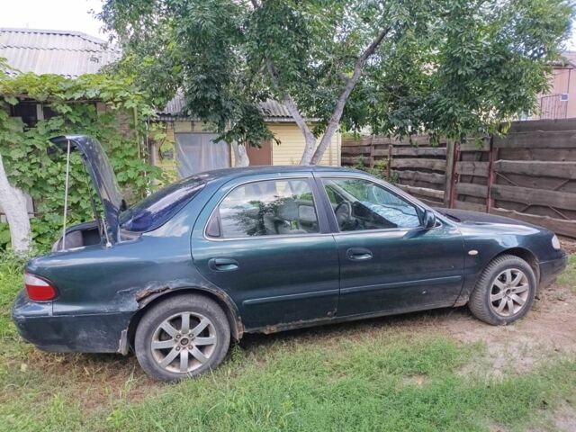 Зелений Кіа Кларус, об'ємом двигуна 2 л та пробігом 323 тис. км за 1000 $, фото 3 на Automoto.ua