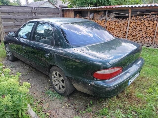 Зелений Кіа Кларус, об'ємом двигуна 2 л та пробігом 323 тис. км за 1000 $, фото 5 на Automoto.ua