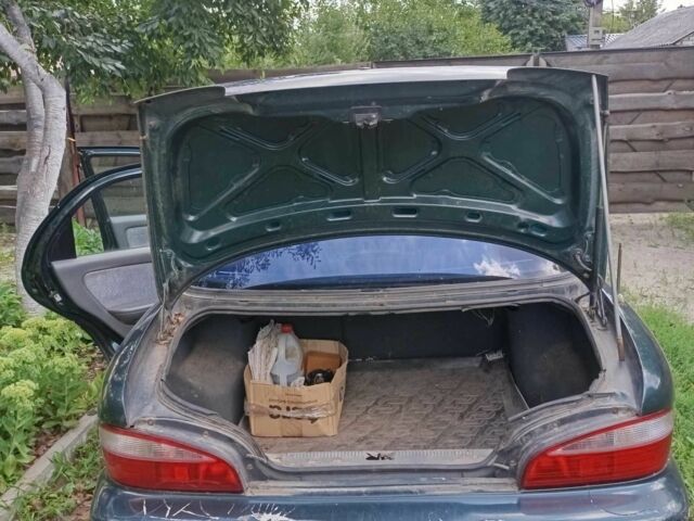 Зелений Кіа Кларус, об'ємом двигуна 2 л та пробігом 323 тис. км за 1000 $, фото 10 на Automoto.ua