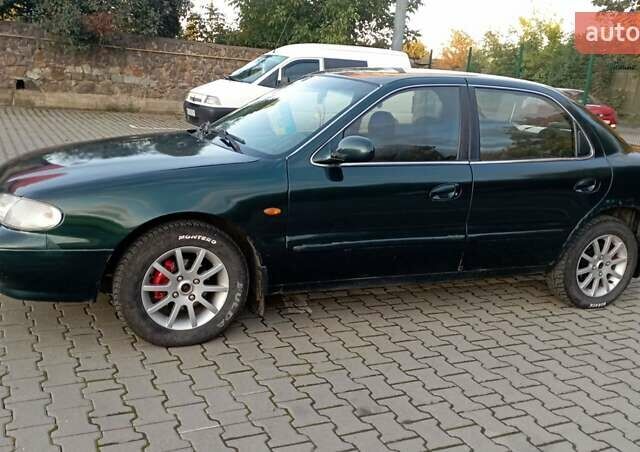 Зелений Кіа Кларус, об'ємом двигуна 1.79 л та пробігом 260 тис. км за 1450 $, фото 7 на Automoto.ua