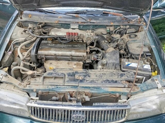 Зелений Кіа Кларус, об'ємом двигуна 2 л та пробігом 323 тис. км за 1000 $, фото 11 на Automoto.ua