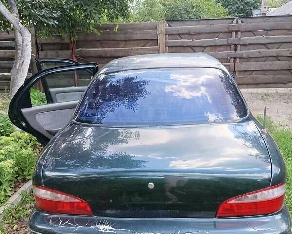 Зеленый Киа Кларус, объемом двигателя 2 л и пробегом 323 тыс. км за 1000 $, фото 5 на Automoto.ua