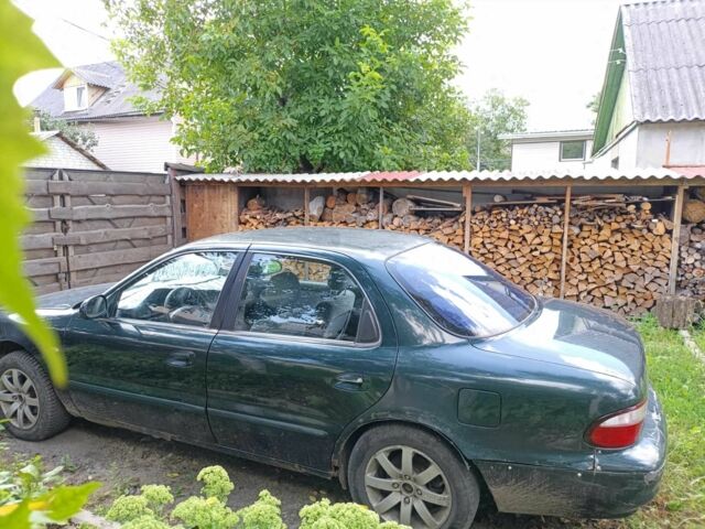 Зелений Кіа Кларус, об'ємом двигуна 2 л та пробігом 323 тис. км за 1000 $, фото 2 на Automoto.ua