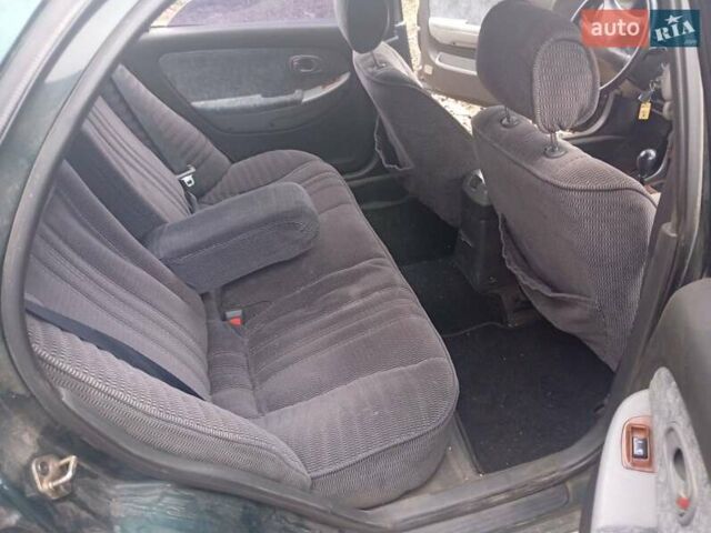 Зелений Кіа Кларус, об'ємом двигуна 2 л та пробігом 320 тис. км за 1250 $, фото 10 на Automoto.ua