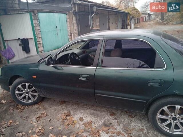 Зелений Кіа Кларус, об'ємом двигуна 2 л та пробігом 320 тис. км за 1250 $, фото 16 на Automoto.ua