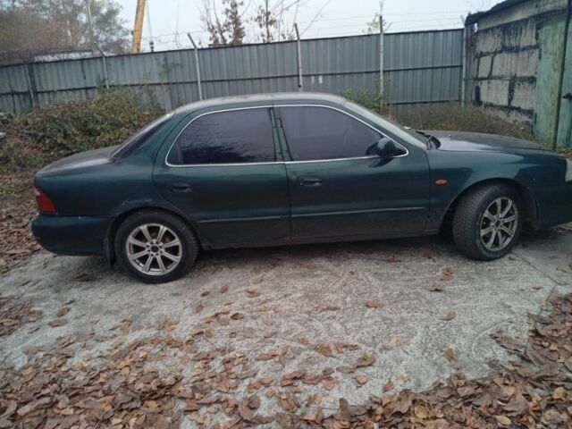 Зеленый Киа Кларус, объемом двигателя 2 л и пробегом 310 тыс. км за 1400 $, фото 10 на Automoto.ua