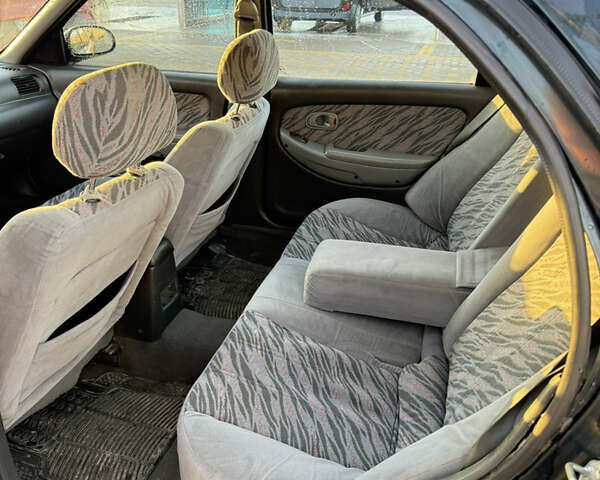 Зеленый Киа Кларус, объемом двигателя 2 л и пробегом 461 тыс. км за 1200 $, фото 8 на Automoto.ua