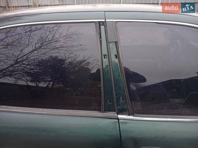 Зелений Кіа Кларус, об'ємом двигуна 2 л та пробігом 320 тис. км за 1250 $, фото 2 на Automoto.ua