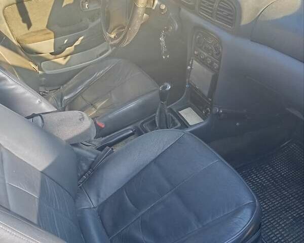 Зеленый Киа Кларус, объемом двигателя 2 л и пробегом 258 тыс. км за 2000 $, фото 4 на Automoto.ua