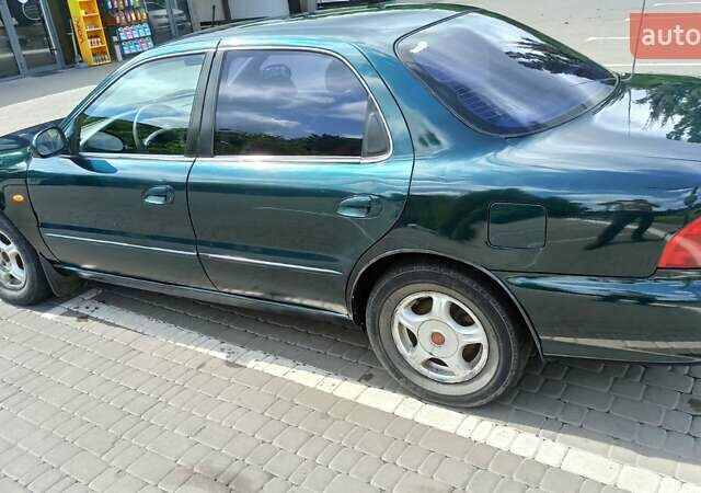 Зеленый Киа Кларус, объемом двигателя 2 л и пробегом 310 тыс. км за 2300 $, фото 2 на Automoto.ua