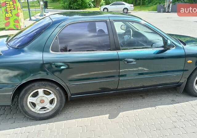 Зеленый Киа Кларус, объемом двигателя 2 л и пробегом 310 тыс. км за 2300 $, фото 3 на Automoto.ua