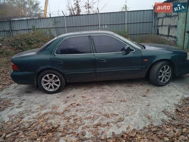 Зелений Кіа Кларус, об'ємом двигуна 2 л та пробігом 320 тис. км за 1250 $, фото 15 на Automoto.ua