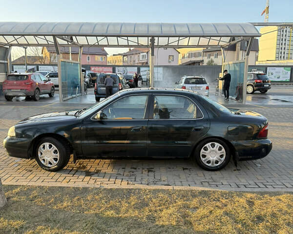 Зеленый Киа Кларус, объемом двигателя 2 л и пробегом 461 тыс. км за 1200 $, фото 5 на Automoto.ua