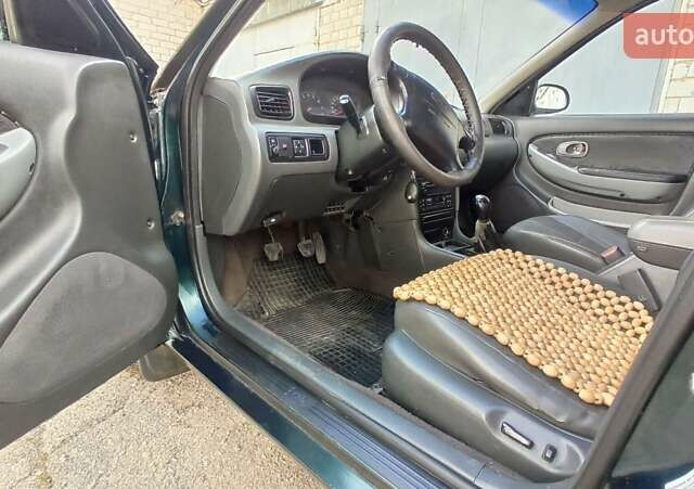 Зеленый Киа Кларус, объемом двигателя 2 л и пробегом 310 тыс. км за 2300 $, фото 12 на Automoto.ua