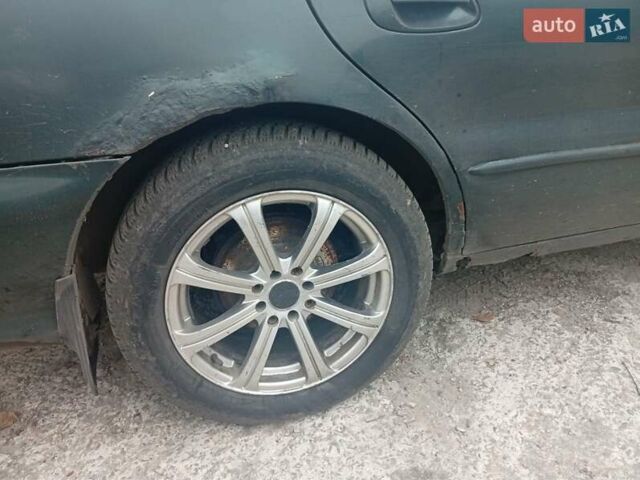 Зелений Кіа Кларус, об'ємом двигуна 2 л та пробігом 320 тис. км за 1250 $, фото 3 на Automoto.ua