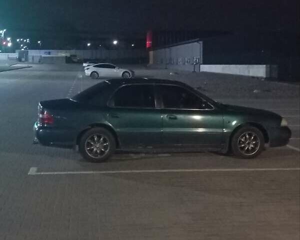 Зеленый Киа Кларус, объемом двигателя 2 л и пробегом 258 тыс. км за 2000 $, фото 1 на Automoto.ua