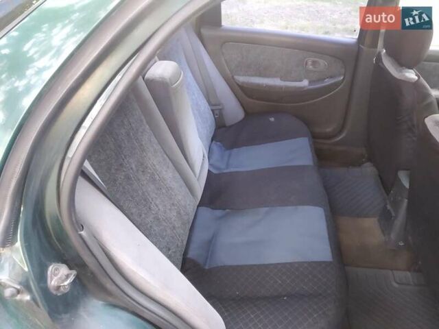 Зелений Кіа Кларус, об'ємом двигуна 2 л та пробігом 195 тис. км за 1650 $, фото 4 на Automoto.ua