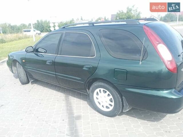 Зелений Кіа Кларус, об'ємом двигуна 1.8 л та пробігом 170 тис. км за 1850 $, фото 13 на Automoto.ua