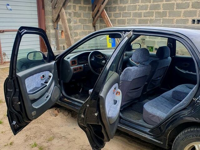 Чорний Кіа Кредос, об'ємом двигуна 2 л та пробігом 315 тис. км за 900 $, фото 2 на Automoto.ua