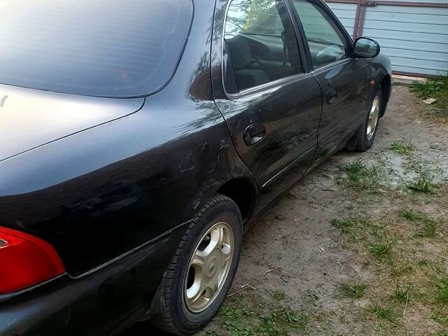 Чорний Кіа Кредос, об'ємом двигуна 2 л та пробігом 315 тис. км за 900 $, фото 5 на Automoto.ua