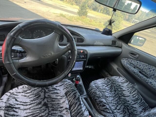 Красный Киа Другая, объемом двигателя 1.5 л и пробегом 245 тыс. км за 1100 $, фото 5 на Automoto.ua