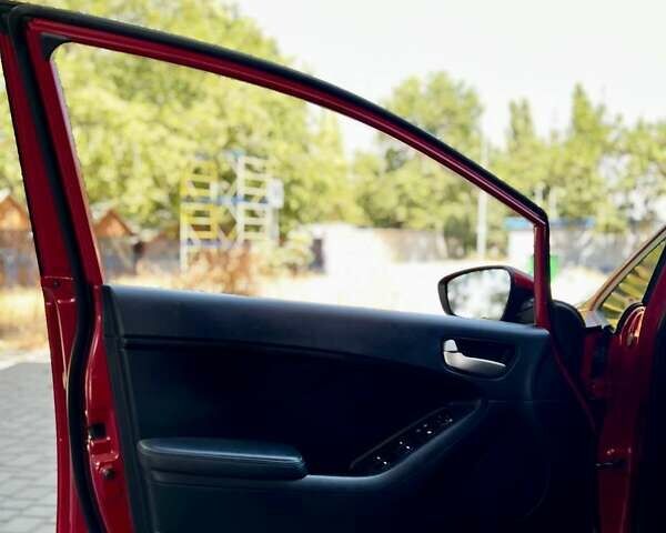 Червоний Кіа Форте, об'ємом двигуна 2 л та пробігом 138 тис. км за 9399 $, фото 6 на Automoto.ua