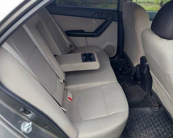 Серый Киа Форте, объемом двигателя 2 л и пробегом 166 тыс. км за 7600 $, фото 4 на Automoto.ua