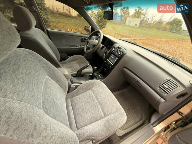 Бежевий Кіа Маджентіс, об'ємом двигуна 2 л та пробігом 165 тис. км за 3900 $, фото 20 на Automoto.ua