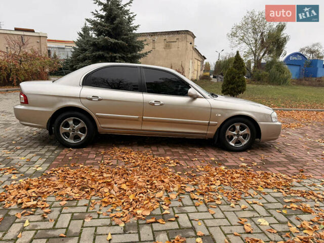 Бежевий Кіа Маджентіс, об'ємом двигуна 2 л та пробігом 165 тис. км за 3900 $, фото 13 на Automoto.ua