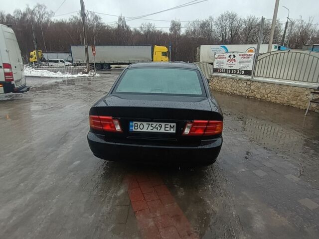 Черный Киа Маджентис, объемом двигателя 2 л и пробегом 220 тыс. км за 2800 $, фото 2 на Automoto.ua