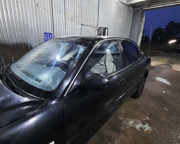 Чорний Кіа Маджентіс, об'ємом двигуна 2 л та пробігом 450 тис. км за 2500 $, фото 1 на Automoto.ua