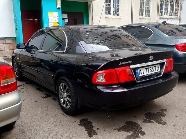 Черный Киа Маджентис, объемом двигателя 2 л и пробегом 200 тыс. км за 3200 $, фото 1 на Automoto.ua