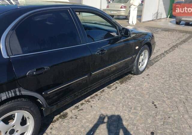 Черный Киа Маджентис, объемом двигателя 2 л и пробегом 275 тыс. км за 3400 $, фото 1 на Automoto.ua