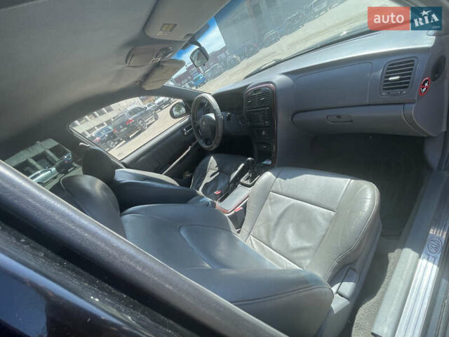 Черный Киа Маджентис, объемом двигателя 2 л и пробегом 350 тыс. км за 2900 $, фото 7 на Automoto.ua
