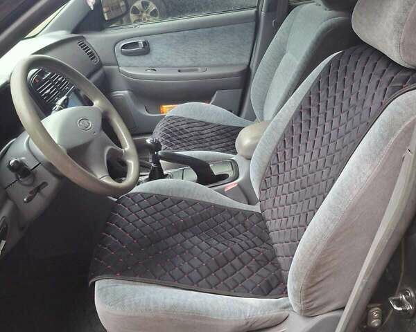 Чорний Кіа Маджентіс, об'ємом двигуна 2 л та пробігом 206 тис. км за 4100 $, фото 7 на Automoto.ua