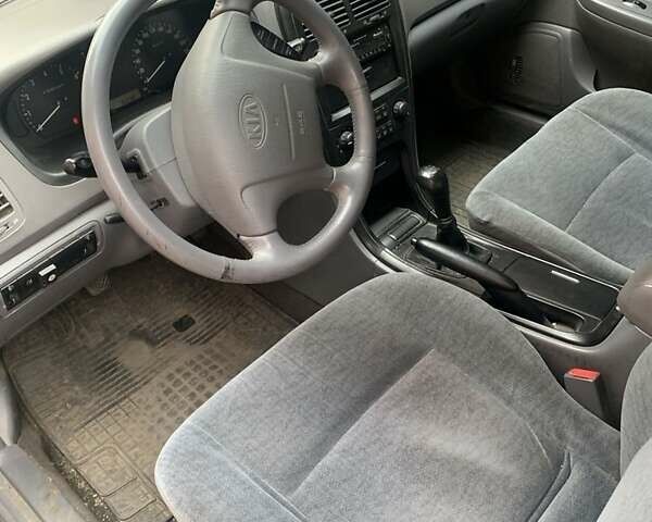 Черный Киа Маджентис, объемом двигателя 2 л и пробегом 161 тыс. км за 4800 $, фото 2 на Automoto.ua