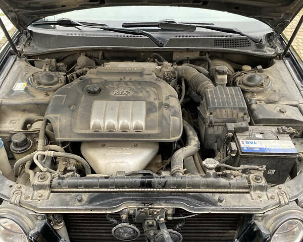 Чорний Кіа Маджентіс, об'ємом двигуна 2 л та пробігом 120 тис. км за 5800 $, фото 6 на Automoto.ua